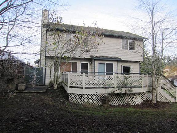 Rear of home with deck