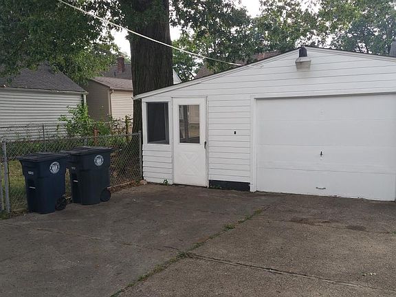 Garage with attached enclosed patio