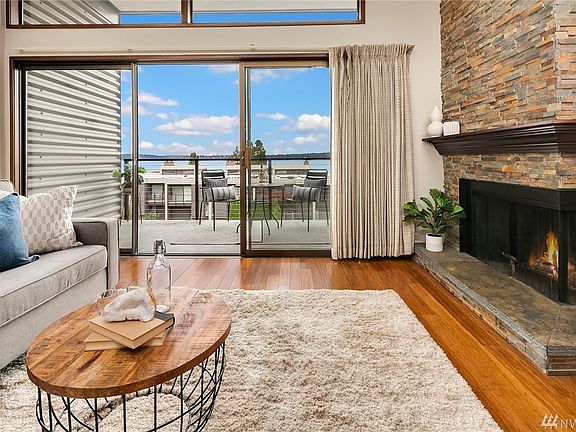 Relax in your living room with a delightful floor-to-ceiling corner fireplace with hearth and mantle, or step out to the view deck.