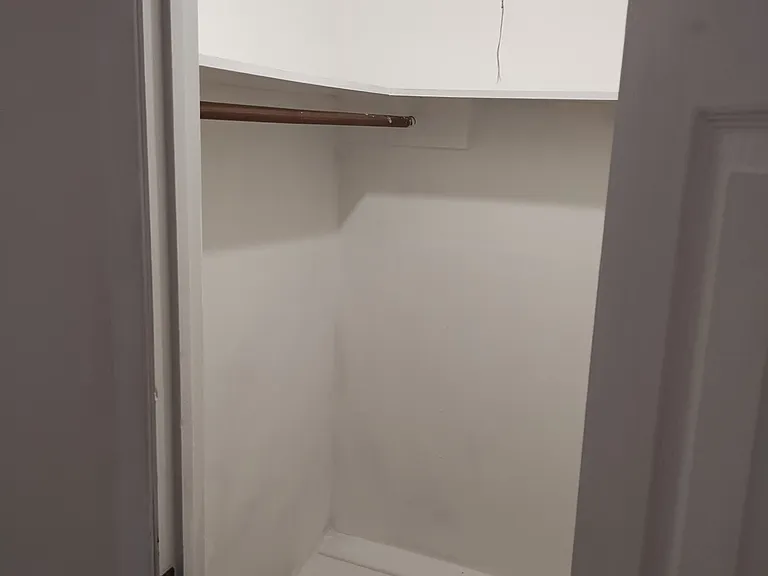 Left side of Front Bedroom closet.