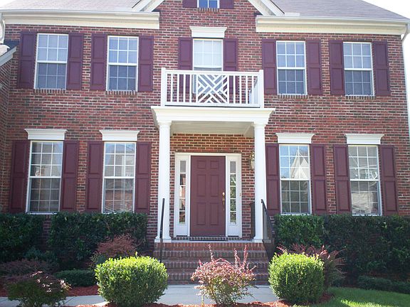 Brick Front, Columns & Rod Iron Railings add Great Curb Appeal