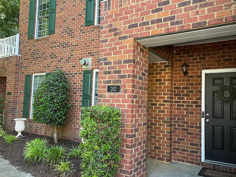 Front porch, garden and second floor balcony
