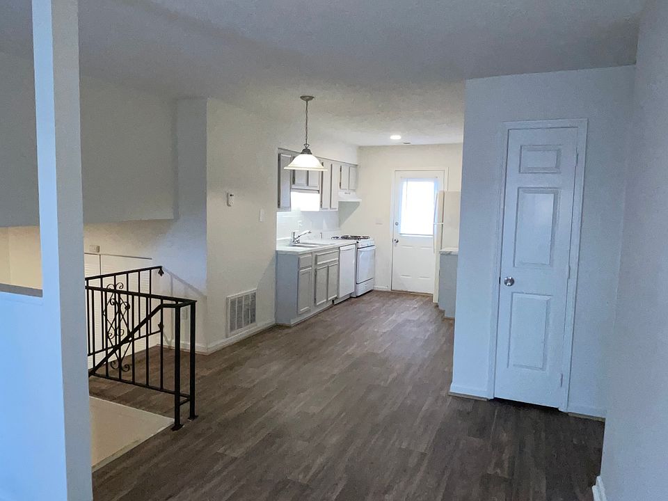 Family room with view of newly designed kitchen complete with new appliances and modern countertops