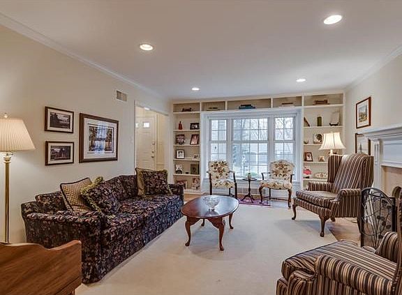 Wonderful built-in shelves surround the front window