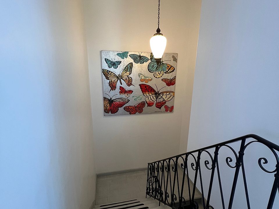 From top of interior stairway. Front door is at bottom of stairway.