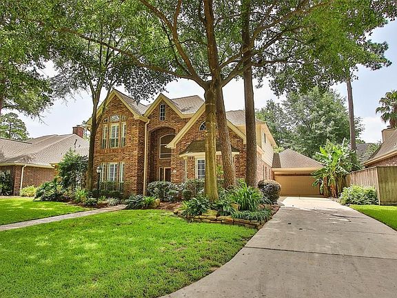 House has over-sized 2 car garage plus a 2 car porte-cochere providing plenty of room.