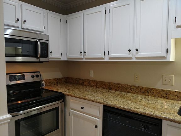 Kitchen view; microwave over stove.