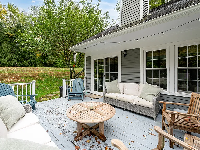 Large private back deck with plenty of seating and open space.