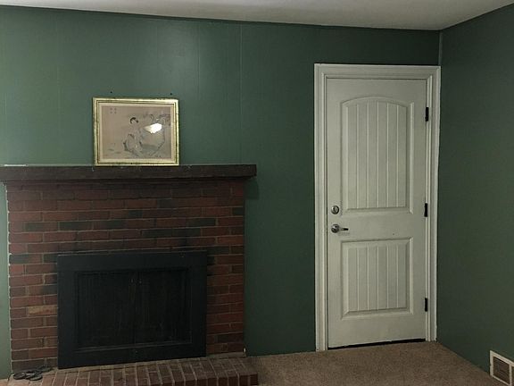 Den and wood burning fireplace