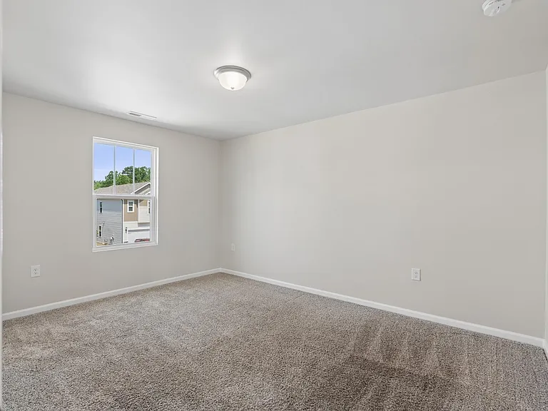 Bedroom with walk in closet