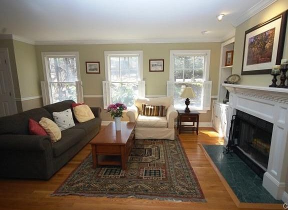 Light and bright living room with wood burning fireplace