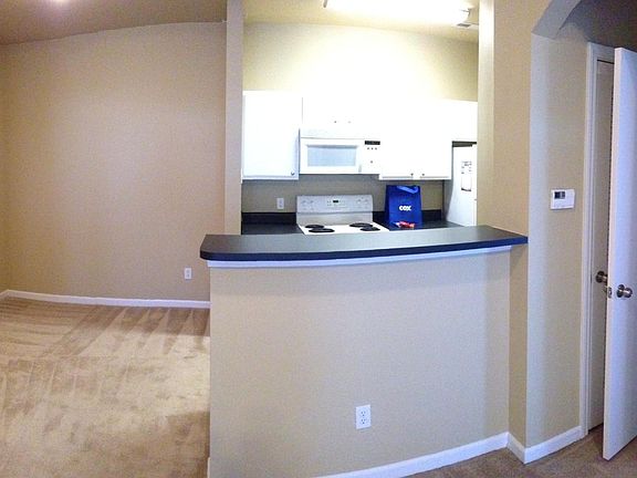 Kitchen and Dining Room area with elegant light fixture
