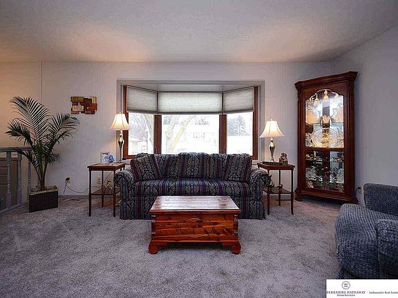 Cozy Living Room with new carpet. Open to the Dining Room. Very nice size room. Updated popular Colors