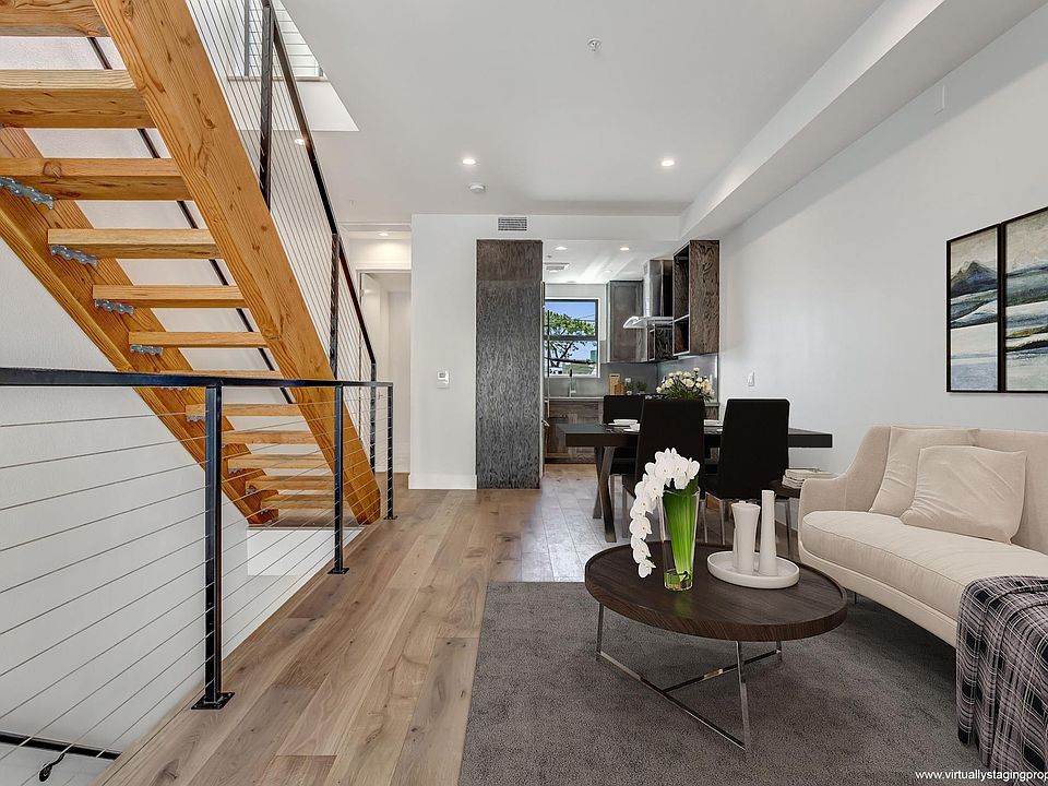 Living room, dining and kitchen.
(*staging picture, this unit is unfurnished)