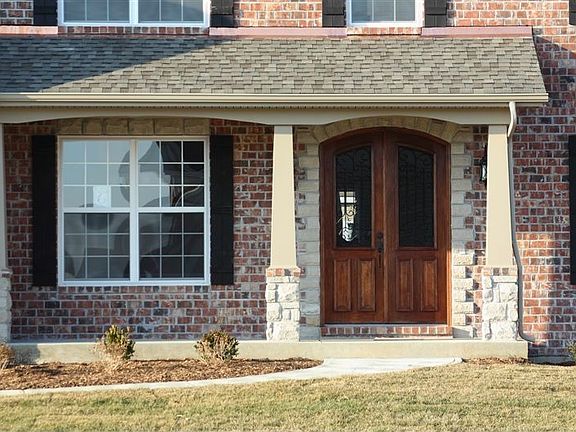 Covered Porch With Stone Column Bases