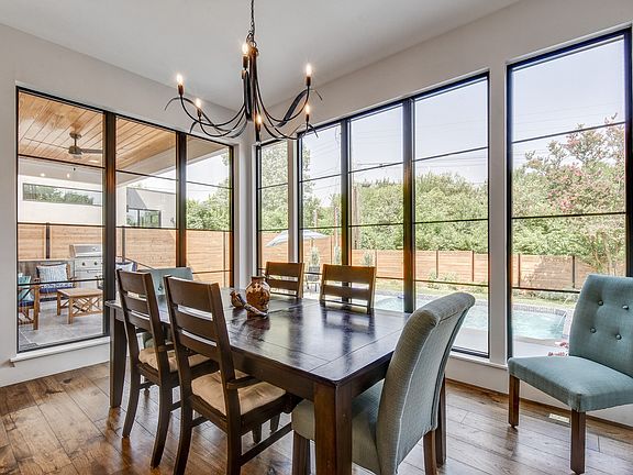Dining area overlooks pool, covered patio. Seats up to 10.