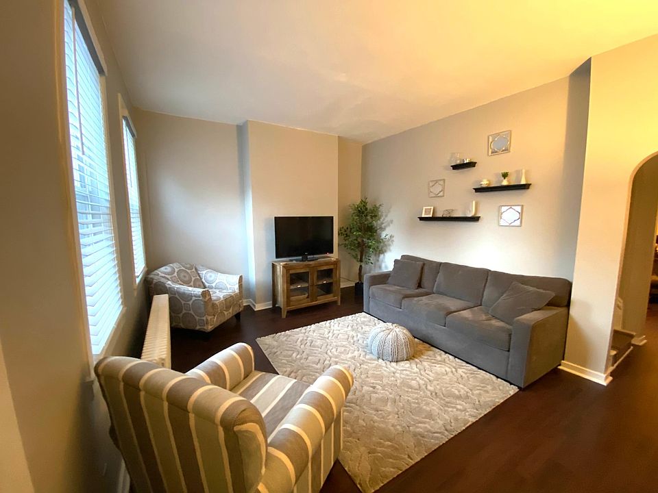 Enter the front door into the living room.