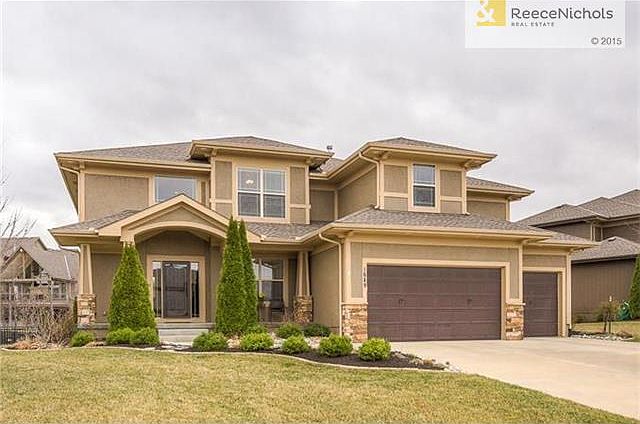 BEAUTIFUL CURB APPEAL WITH LOVELY UPGRADED LANSCAPING!