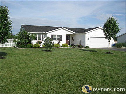 Front view of home faces east,field & woods across the road