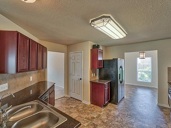 Kitchen has upgraded granite counters and gas range w/ frig negotiable !