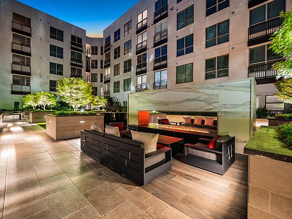 Expansive social courtyard with double-sided fireplace