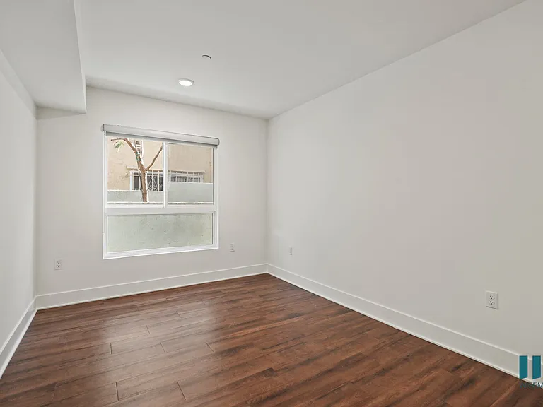 Bedroom with Large-Size Windows, Vinyl Flooring, and Recessed Lighting