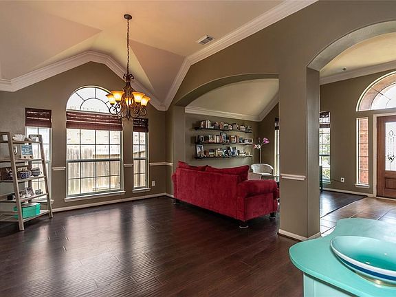 Just past the Formal Living Room is the Formal Dining Room.  The wall of windows, double crown molding and chair rail inviting.  This home is perfect for entertaining!