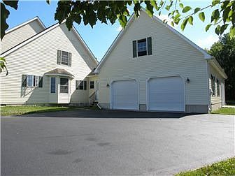 Paved driveway with breezeway service door