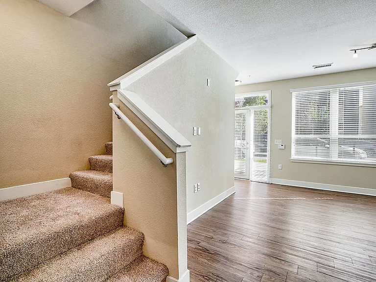 Two-floor townhomes with carpeted stairs