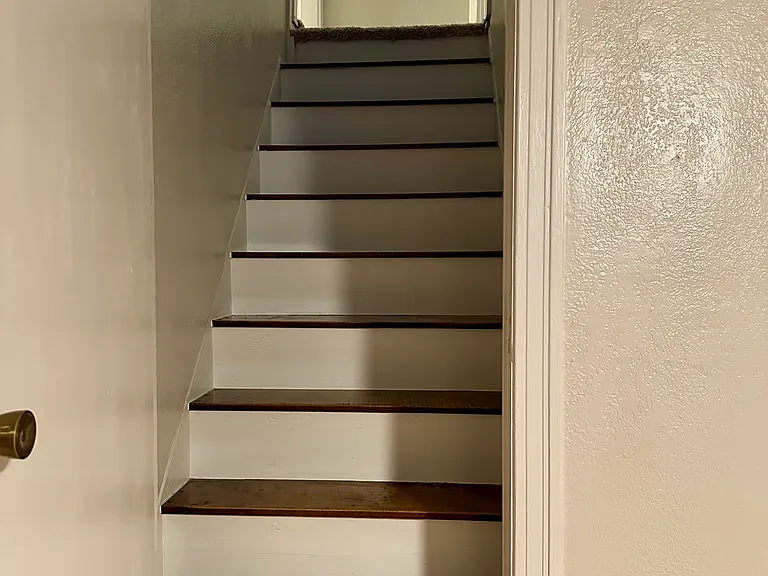Stairs to master suite (connects to dining room area)