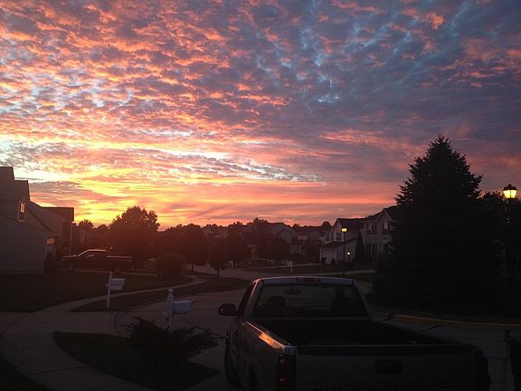 View out front door at sunset
						:
						View looking West -down development out of front door at sunset.