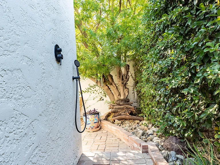 Outdoor shower behind casita