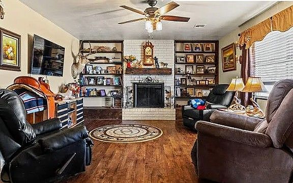 extra comfy living room. TV, Fireplace, picture window.