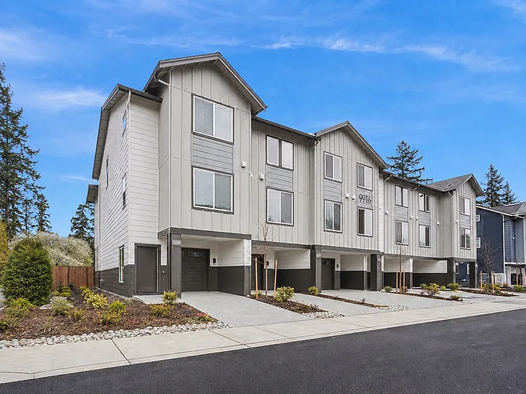 Beautiful corner unit w/front door or garage entrance.