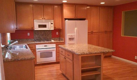 Kitchen with granite countertops and ample closet space