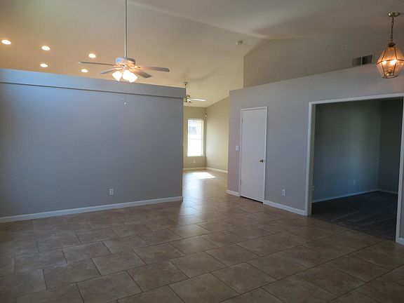 Living room with formal dining area. Den/office on the right