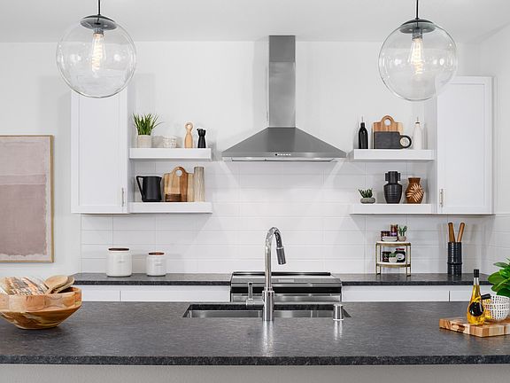 Floating shelves and subway tile backsplash