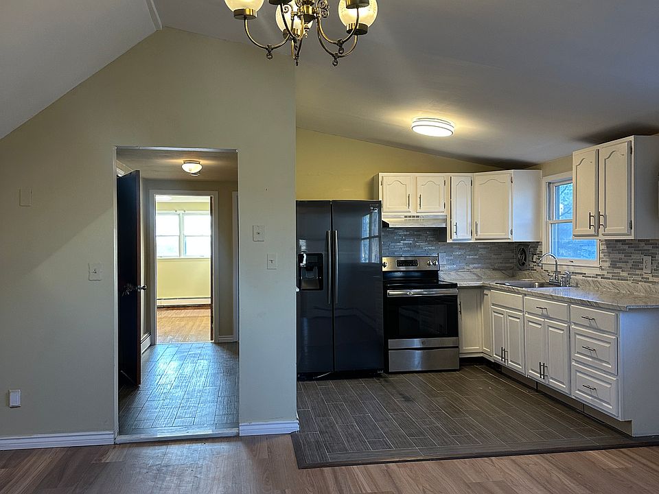 Bright kitchen, hallway living dining area combo