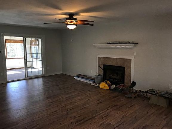 Living room with fireplace- new floors!