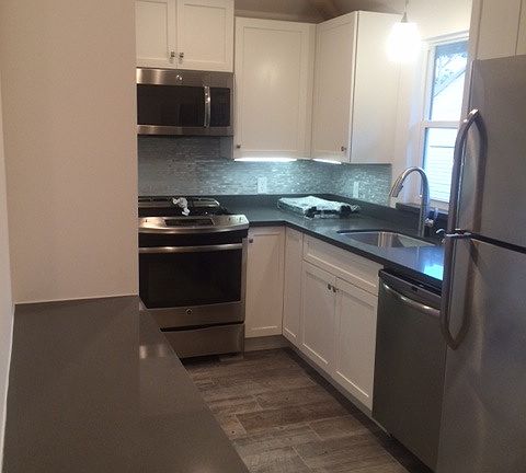 Kitchen with new appliances and custom finishes