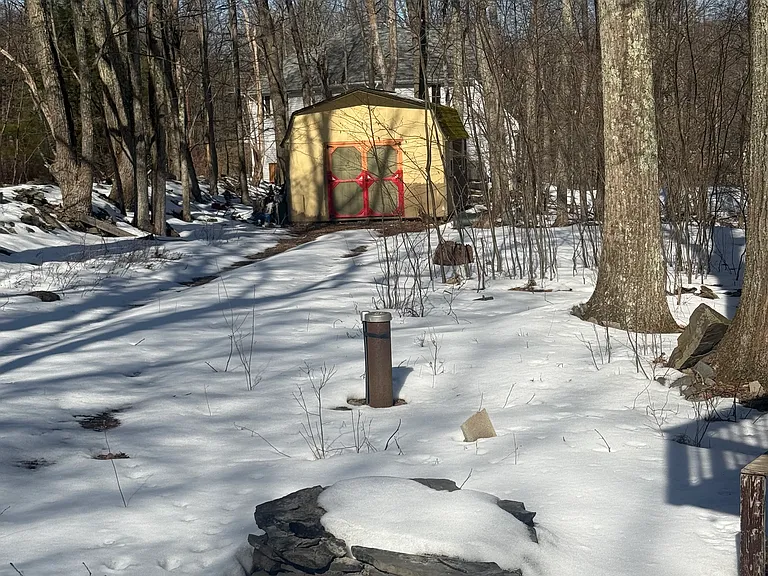 Large shed on over an acre of wooded property
