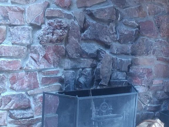 floor to ceiling rock fireplace