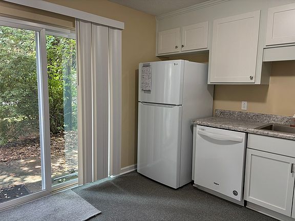 Bring the outdoors closer with new secure sliding glass door. The kitchen features new cabinets and appliances for daily ease. This inviting space makes cooking and dining a pleasure.