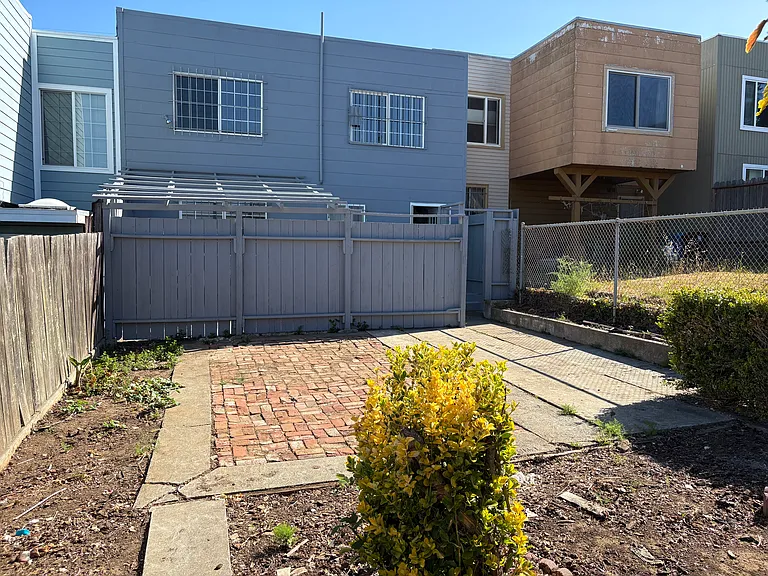 Backyard with patio and gardening and cement