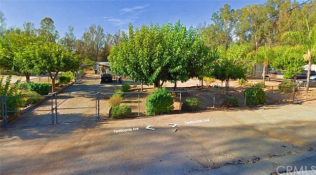 Google Map View.  Large 26,136 SF Lot (.60 Acre).  Trees, Shrubs, Completely fenced in nice rural type neighborhood, but just .5 miles away from Lake Elsinore Outlet Stores.