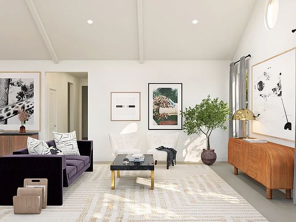 Great room with vaulted ceiling and white painted ceiling beams