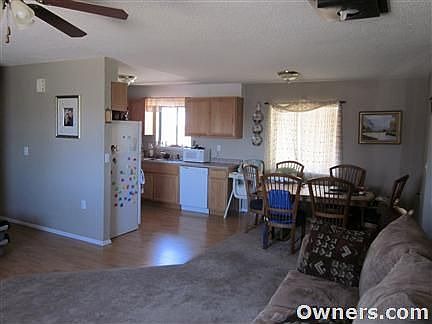 View from Living room into Dining and Kitchen