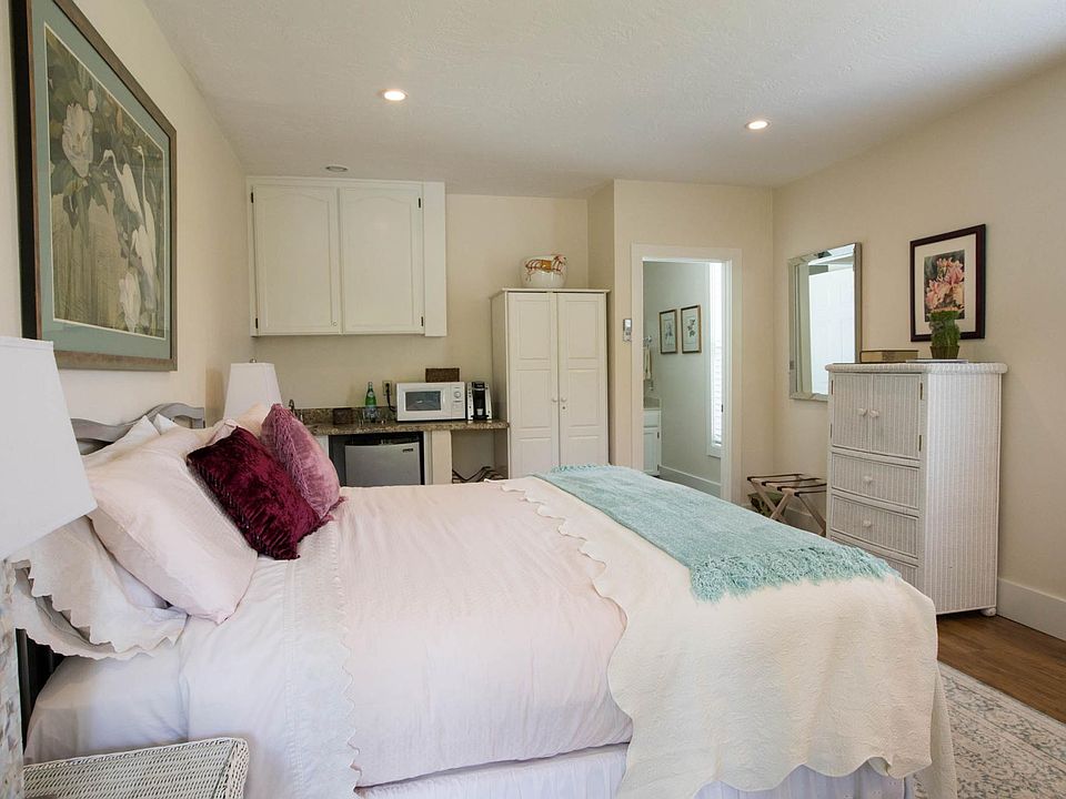 King size bed
Kitchenette counter and wardrobe in background. Door leading to bathroom on right.