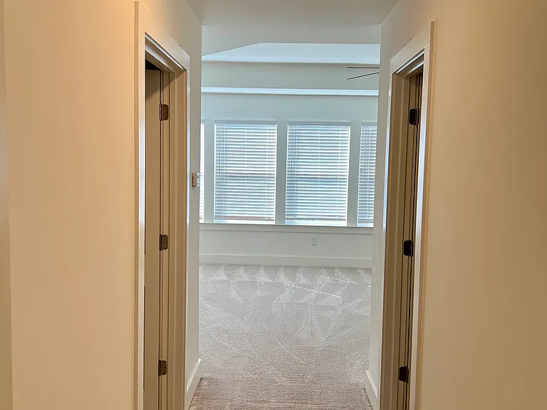 Master suite includes a large private bathroom on the left and a walk in closet on the right