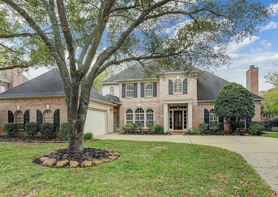 RARE FIND on the Cinco Ranch Golf course with balcony overlooking outdoor oasis!